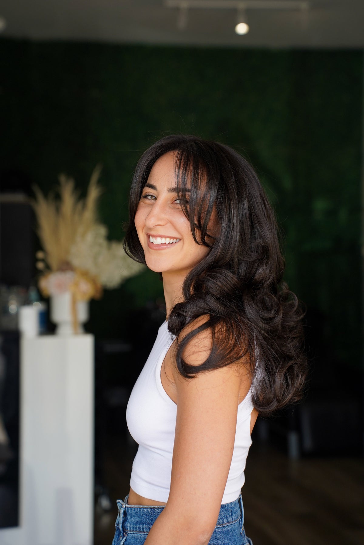 Brunette hair with soft waves and a face-framing fringe at My Hair Co.